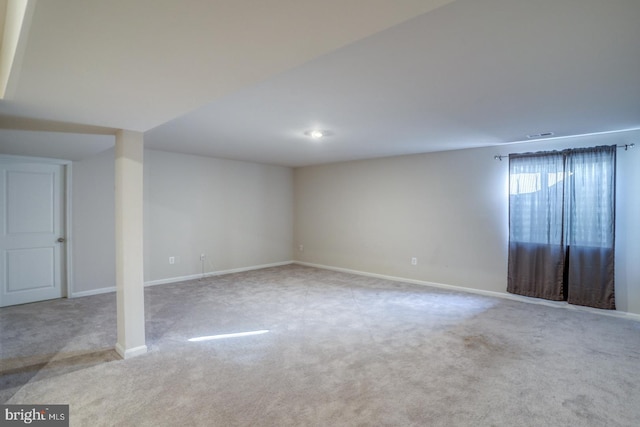 interior space featuring carpet flooring and baseboards