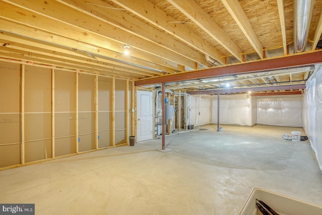 unfinished basement with water heater