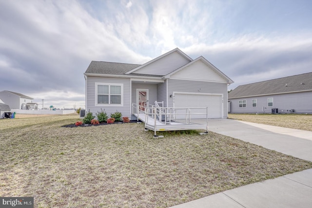 single story home featuring a garage, a front yard, cooling unit, and driveway