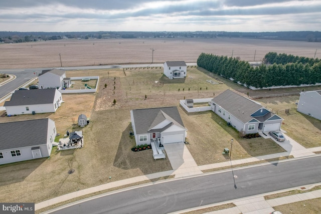 birds eye view of property with a rural view