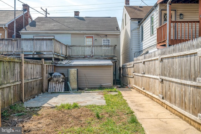 back of house with a patio and a fenced backyard