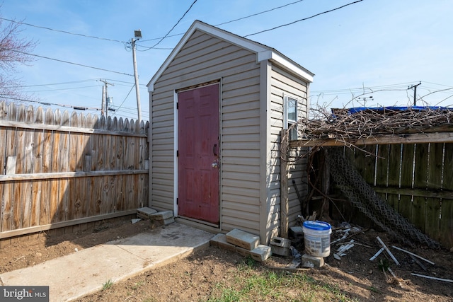 view of shed featuring a fenced backyard