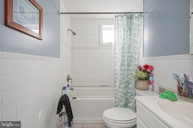 bathroom featuring toilet, tile walls, tile patterned flooring, and shower / bath combination with curtain