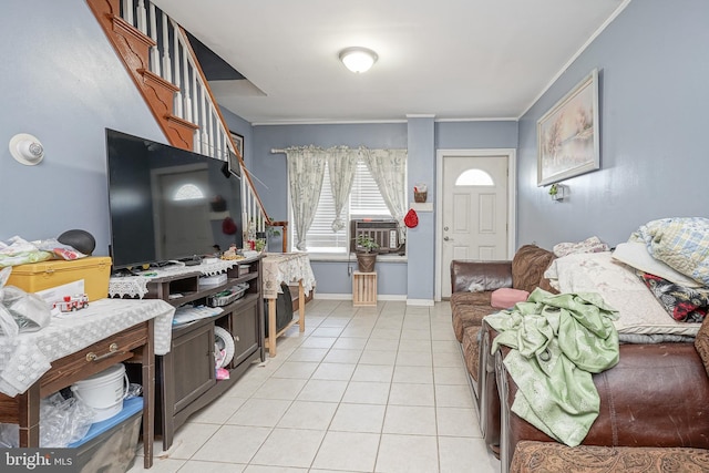 living room featuring light tile patterned floors, cooling unit, baseboards, and ornamental molding