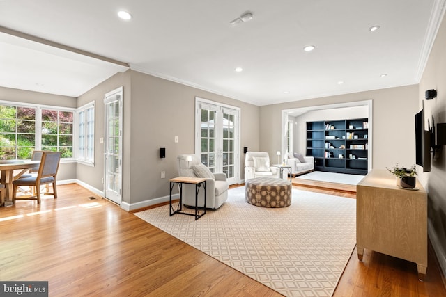 3517 Woodbine St, Chevy Chase, MD 20815 - living area with french doors, recessed lighting, baseboards, light wood-type flooring, and ornamental molding