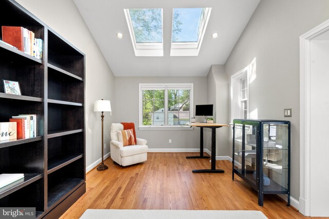 3517 Woodbine St, Chevy Chase, MD 20815 - living area featuring a skylight, baseboards, recessed lighting, and wood finished floors