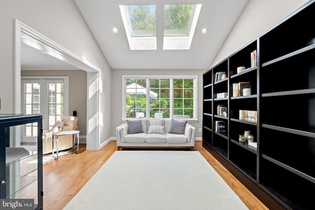 3517 Woodbine St, Chevy Chase, MD 20815 - living area with recessed lighting, wood finished floors, and vaulted ceiling with skylight
