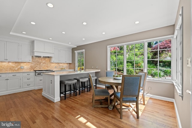 3517 Woodbine St, Chevy Chase, MD 20815 - dining area with a healthy amount of sunlight, baseboards, and light wood finished floors