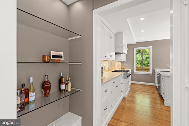3517 Woodbine St, Chevy Chase, MD 20815 - bar with backsplash, premium range hood, baseboards, light wood finished floors, and recessed lighting