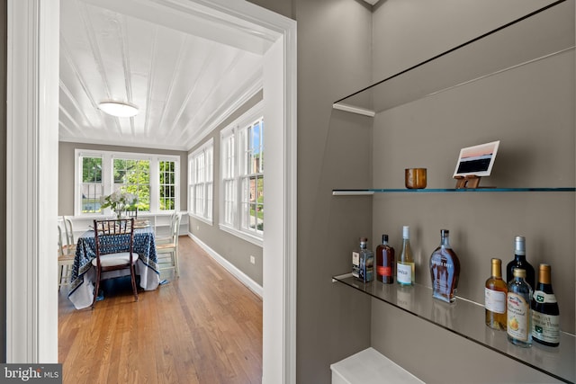3517 Woodbine St, Chevy Chase, MD 20815 - bar with baseboards and wood finished floors