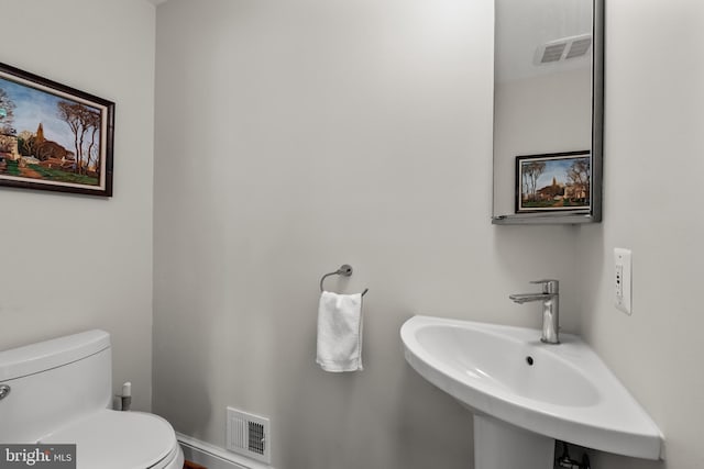 3517 Woodbine St, Chevy Chase, MD 20815 - bathroom featuring a sink, toilet, and visible vents