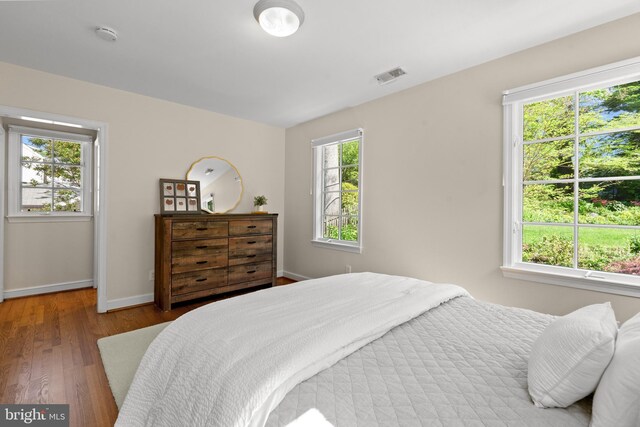 3517 Woodbine St, Chevy Chase, MD 20815 - bedroom featuring visible vents, baseboards, and wood finished floors
