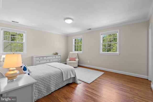 3517 Woodbine St, Chevy Chase, MD 20815 - bedroom featuring visible vents, ornamental molding, baseboards, and wood finished floors
