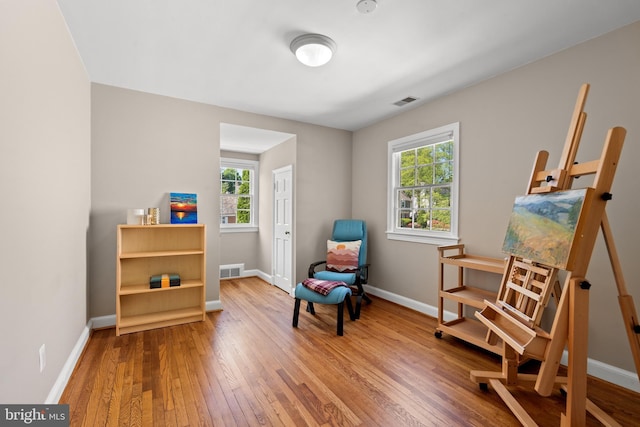 3517 Woodbine St, Chevy Chase, MD 20815 - living area featuring baseboards, a wealth of natural light, hardwood / wood-style floors, and visible vents