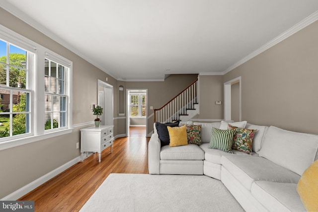 3517 Woodbine St, Chevy Chase, MD 20815 - living area featuring crown molding, baseboards, stairs, and light wood-style flooring