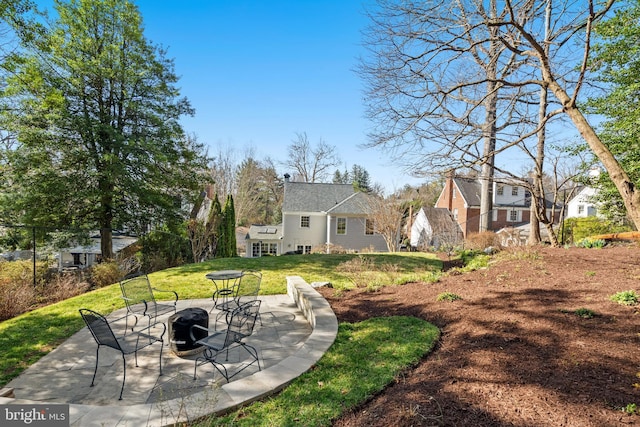 3517 Woodbine St, Chevy Chase, MD 20815 - view of yard with a patio and a fire pit