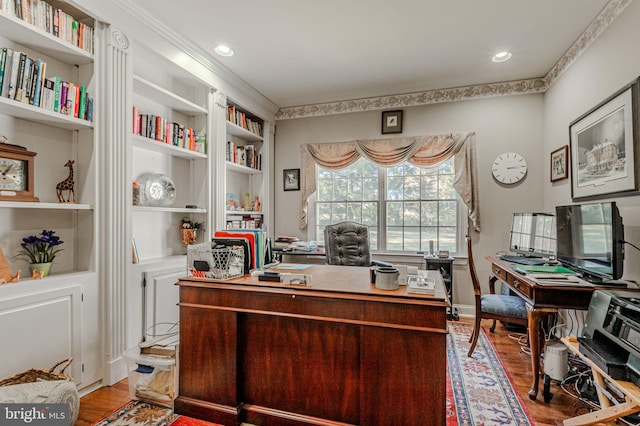 office space with built in features, wood finished floors, and recessed lighting