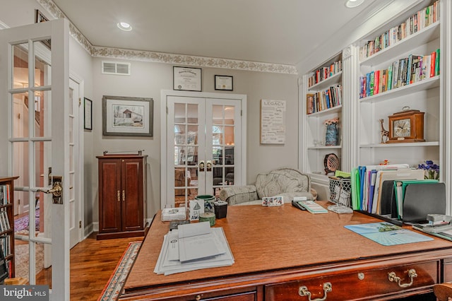 office with wood finished floors, french doors, and visible vents