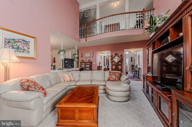 living room featuring a high ceiling