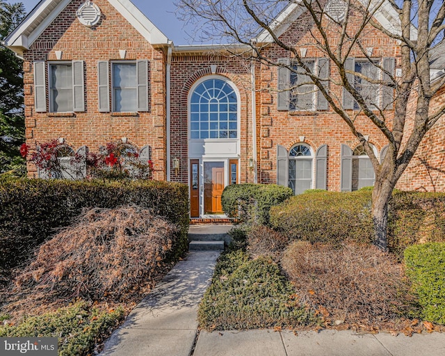 view of front of home with brick siding