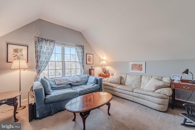 living area featuring lofted ceiling and carpet floors