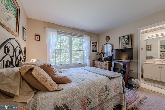 bedroom featuring connected bathroom