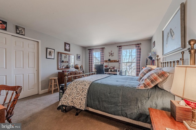 bedroom featuring baseboards and carpet floors