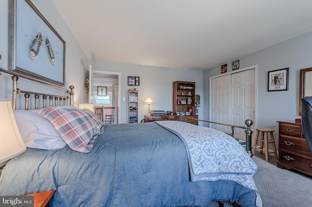 bedroom featuring a closet and carpet floors