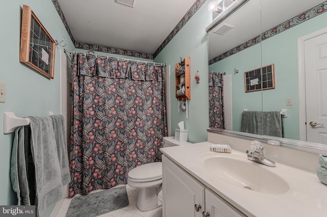 bathroom with visible vents, toilet, curtained shower, tile patterned flooring, and vanity