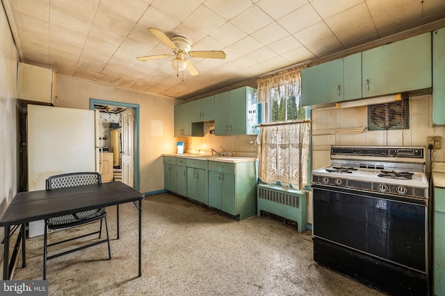 kitchen featuring radiator, green cabinets, light countertops, range with electric stovetop, and a ceiling fan