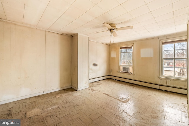 empty room with tile patterned floors, a ceiling fan, cooling unit, baseboards, and baseboard heating