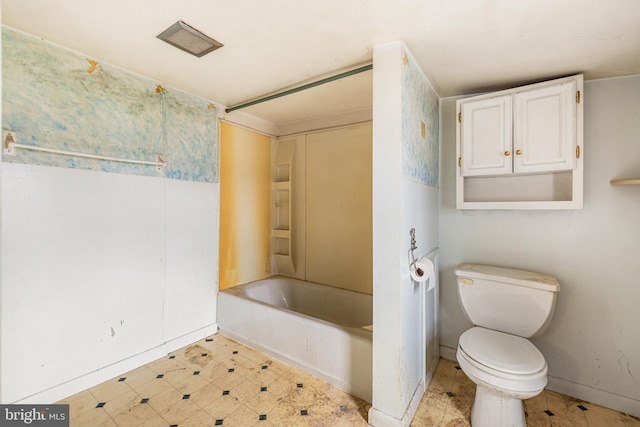 full bathroom featuring tile patterned floors, toilet, and shower / bath combination