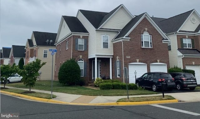 traditional home featuring an attached garage, brick siding, and concrete driveway