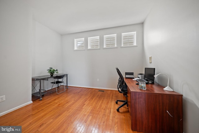 office featuring light wood-style flooring and baseboards