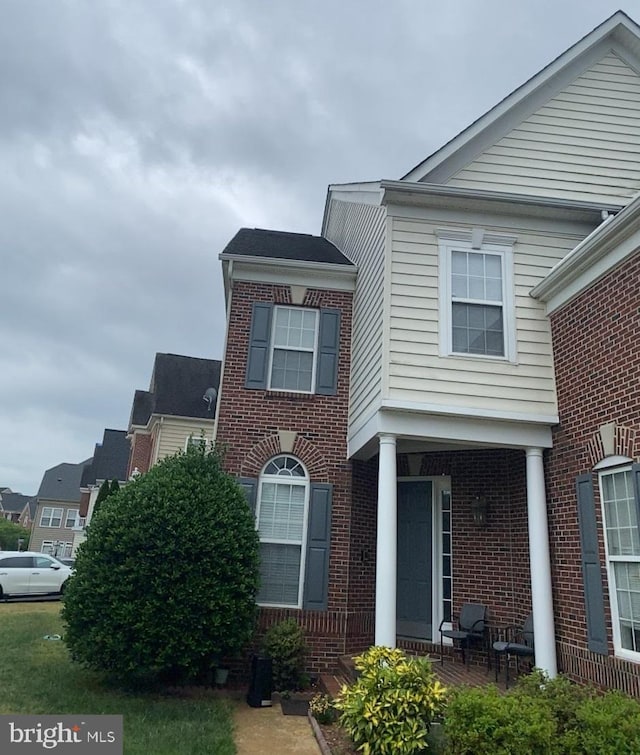view of front of house with brick siding