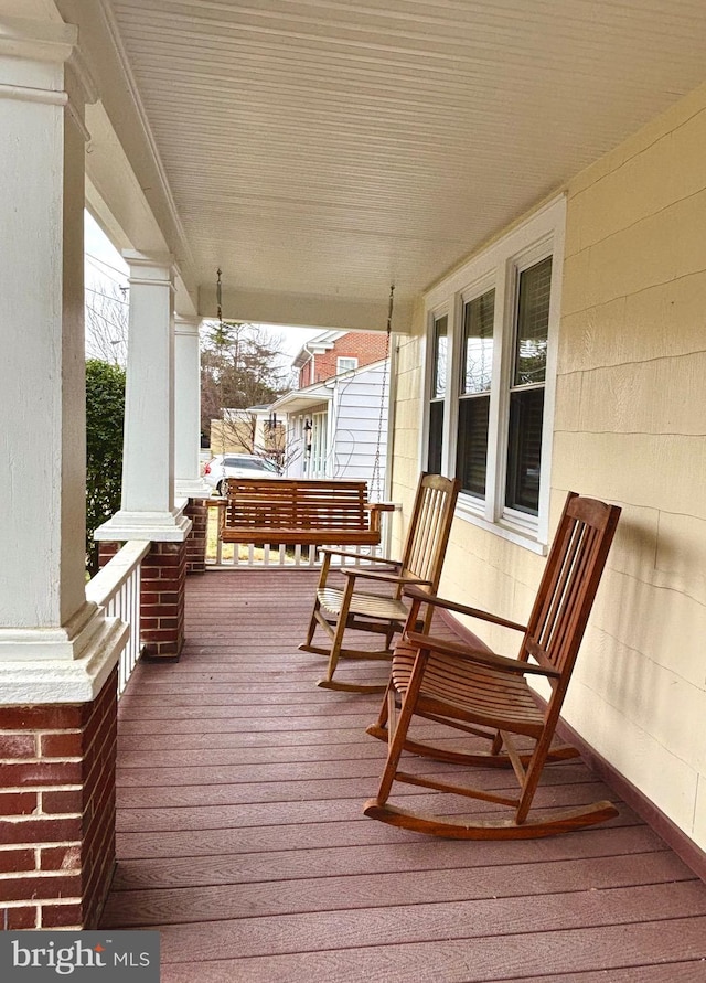 wooden deck featuring covered porch