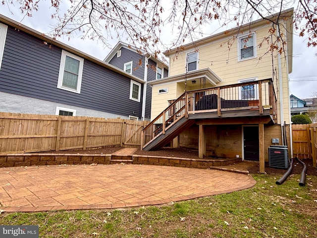 back of property featuring a patio, stairway, a fenced backyard, a deck, and central air condition unit