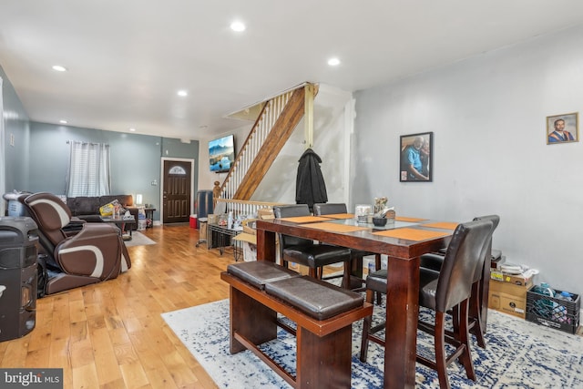 dining room featuring recessed lighting, stairway, and light wood finished floors