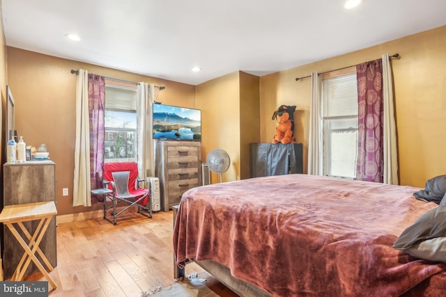 bedroom featuring recessed lighting, baseboards, and wood finished floors