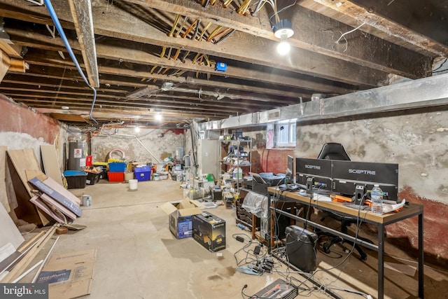 unfinished basement featuring water heater