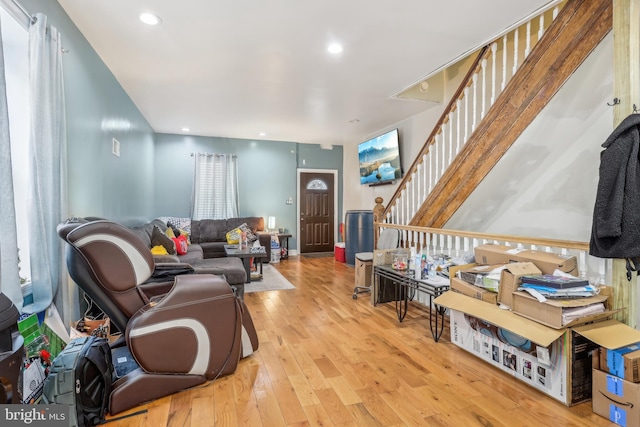 living room featuring stairway, recessed lighting, and wood-type flooring