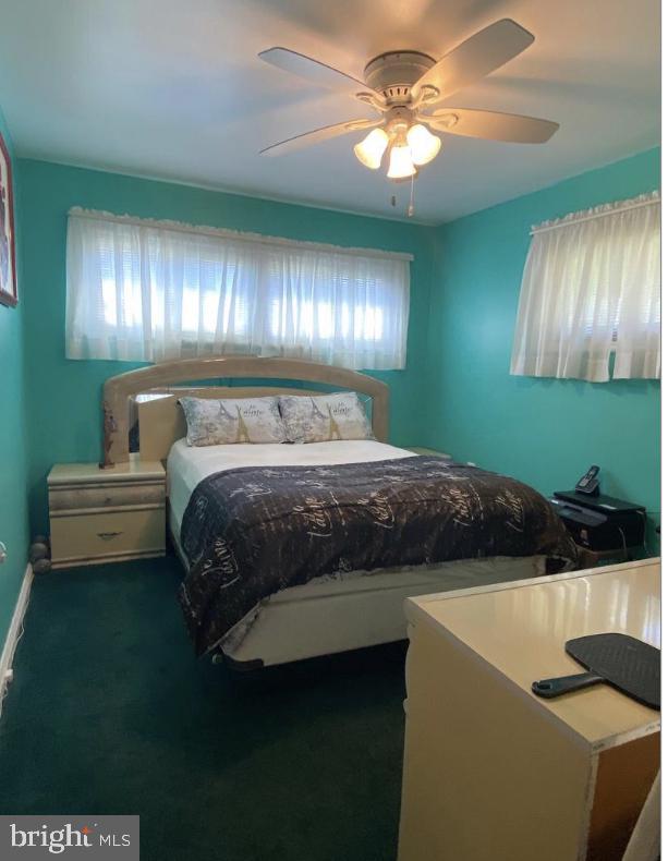 bedroom with carpet flooring and ceiling fan