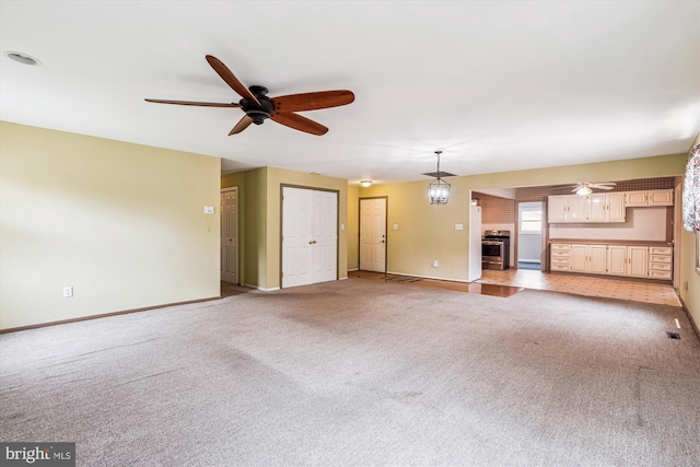 12703 Kembridge Dr, Bowie, MD 20715 - unfurnished living room featuring ceiling fan, baseboards, and light carpet