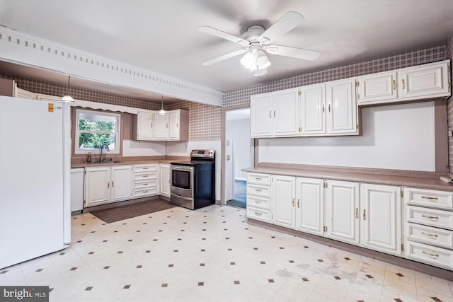 12703 Kembridge Dr, Bowie, MD 20715 - kitchen with white appliances, a sink, ceiling fan, light floors, and white cabinetry
