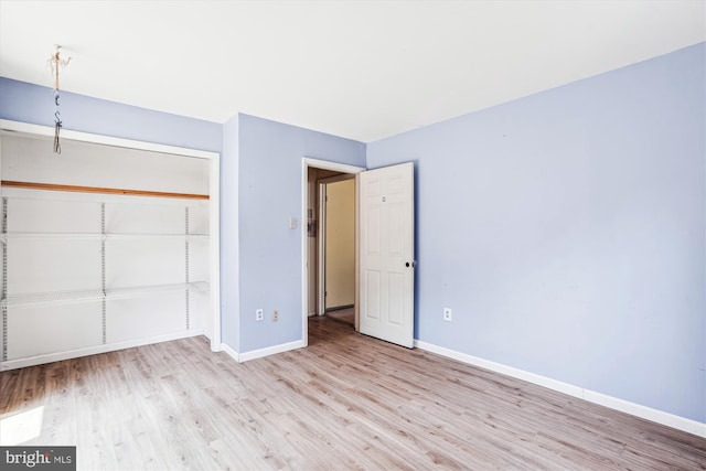 12703 Kembridge Dr, Bowie, MD 20715 - unfurnished bedroom with wood finished floors, baseboards, and a closet