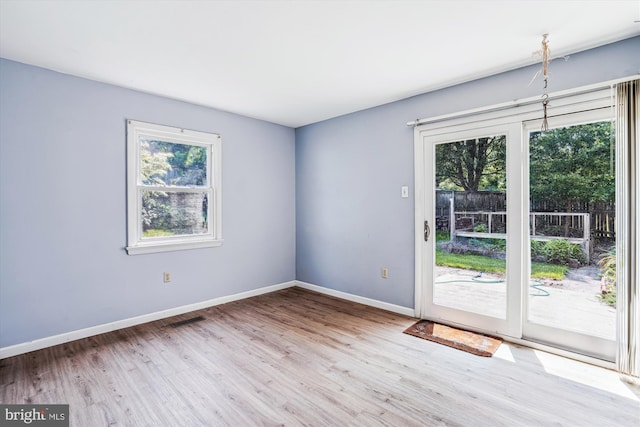 12703 Kembridge Dr, Bowie, MD 20715 - empty room with wood finished floors and baseboards