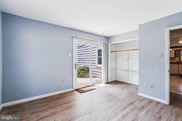 12703 Kembridge Dr, Bowie, MD 20715 - unfurnished bedroom featuring access to exterior, wood finished floors, and baseboards