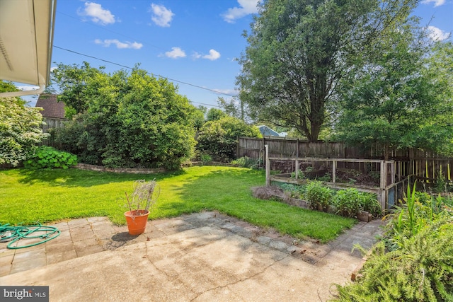 12703 Kembridge Dr, Bowie, MD 20715 - view of yard featuring a patio and a vegetable garden