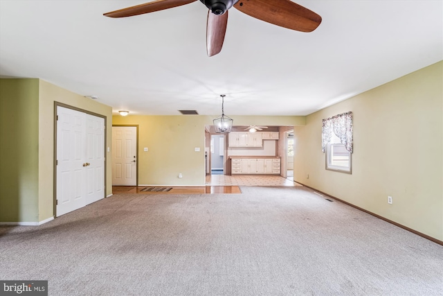 12703 Kembridge Dr, Bowie, MD 20715 - unfurnished living room featuring ceiling fan, carpet flooring, and baseboards
