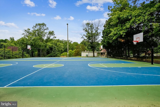 view of sport court with community basketball court and fence